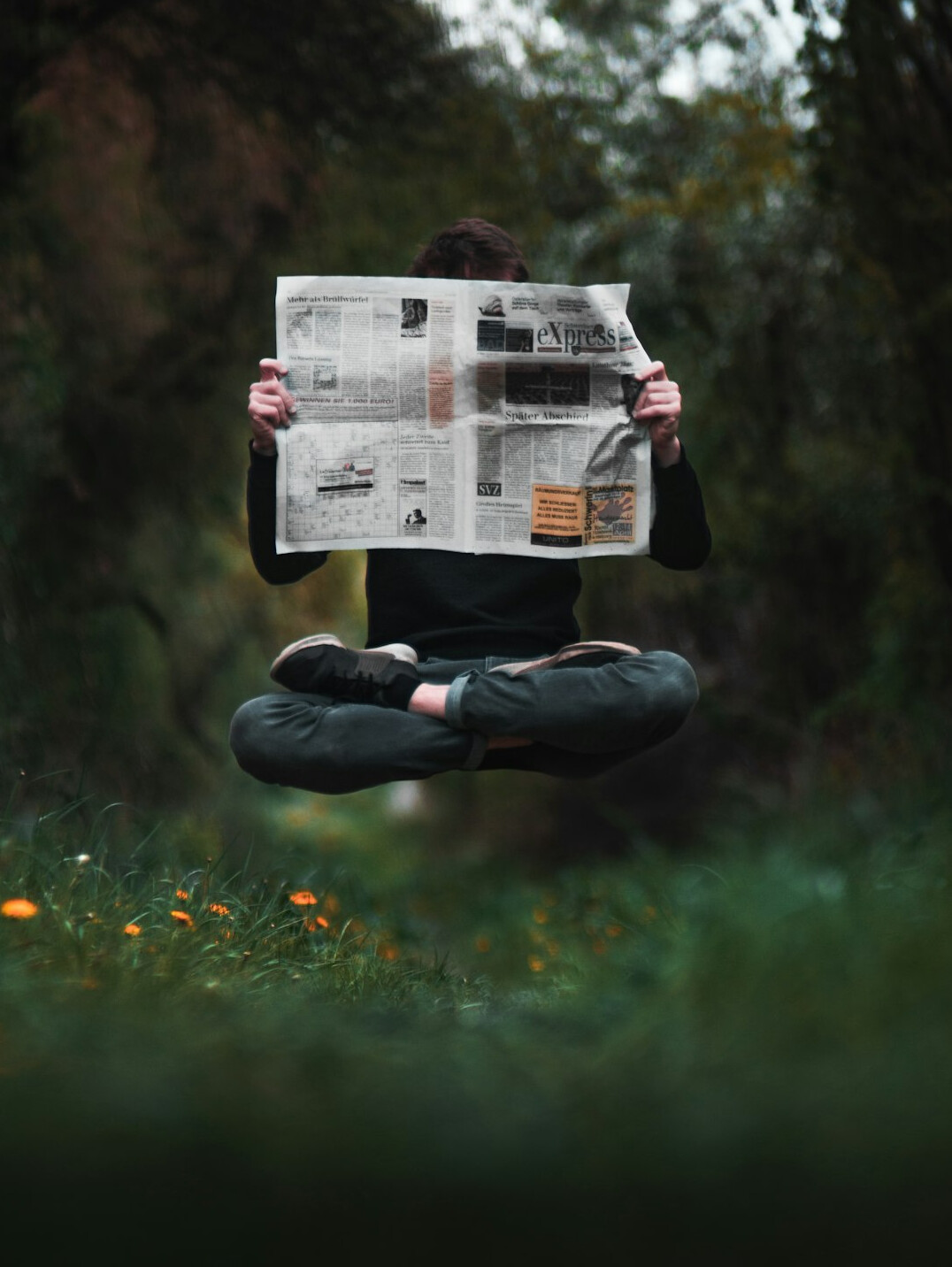 person reading newspaper